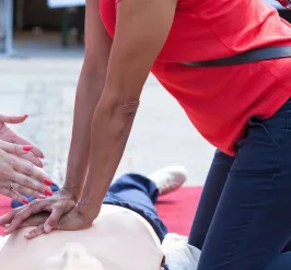 Instructor leading student in CPR training course
