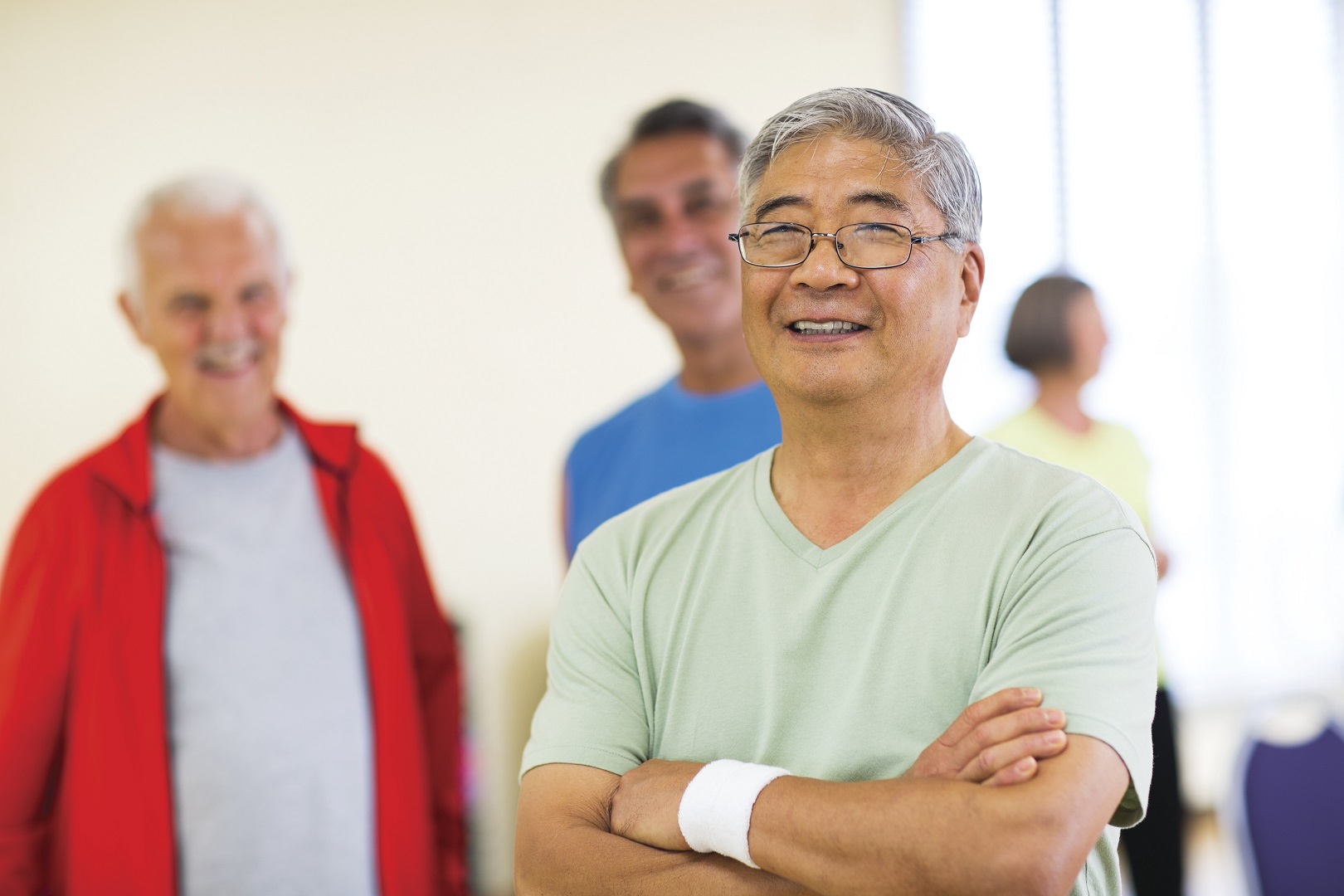 Three older adults waiting their turn to play pickleball at YMCA Louisville Three older adults waiting their turn to play pickleball at YMCA Louisville