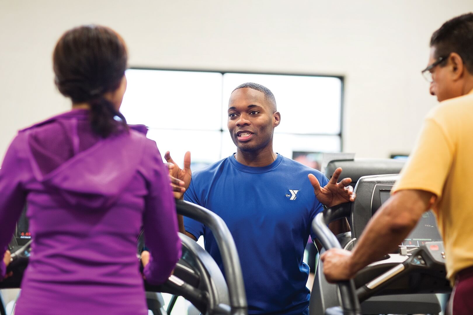 YMCA Louisville trainer coaching member for fitness assessment YMCA Louisville trainer coaching member for fitness assessment