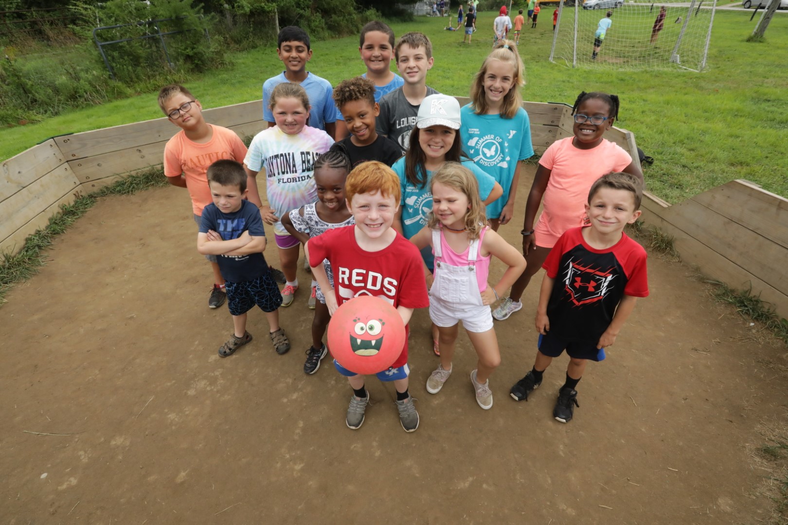 YMCA Louisville children pose on a playground for community programs YMCA Louisville children pose on a playground for community programs