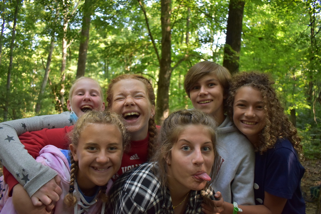 Five teens smile and make funny faces for the camera Five teens smile and make funny faces for the camera