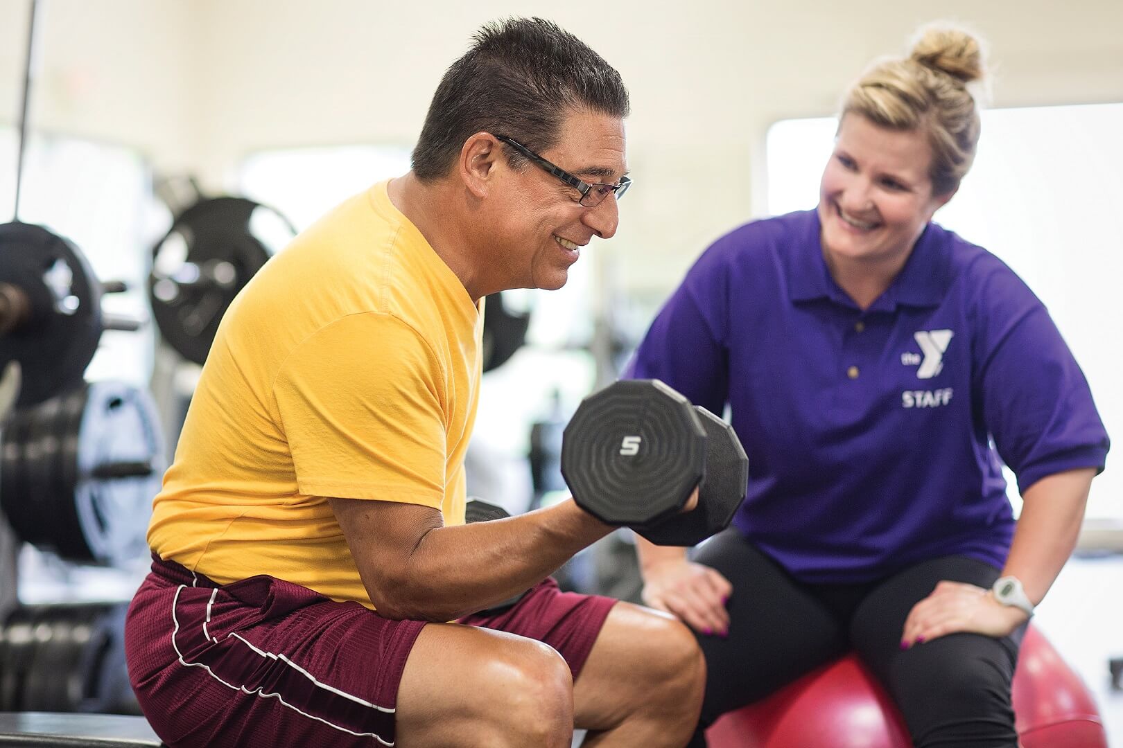 Man and instructor doing strength training at YMCA Louisville