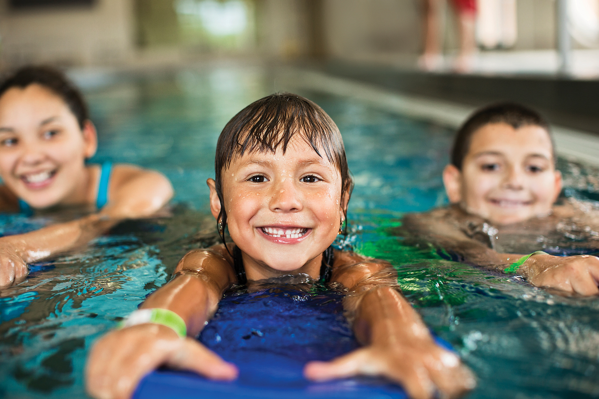 Children swimming at YMCA Louisville swimming pool Children swimming at YMCA Louisville swimming pool