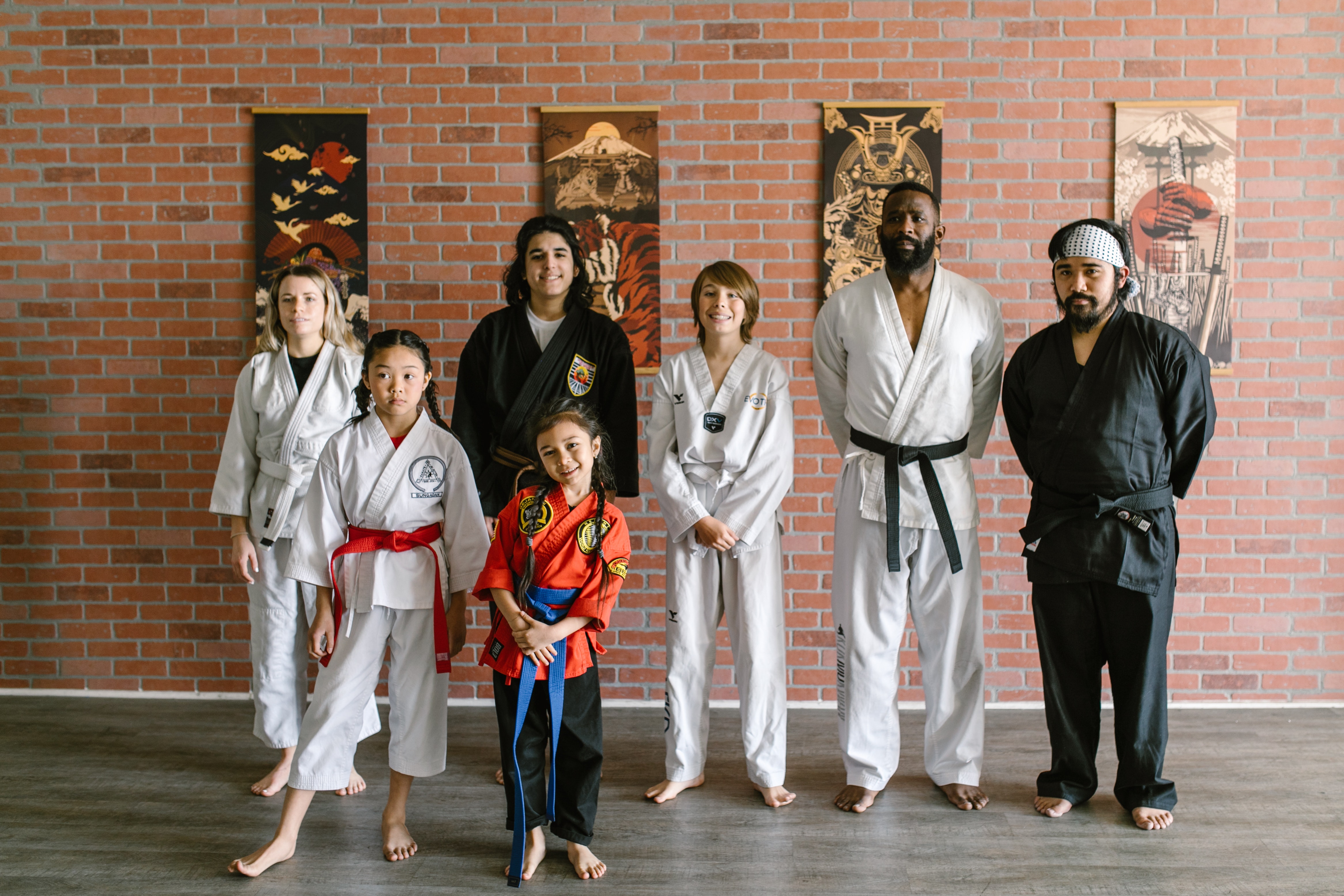 Martial arts teachers and students smiling for the camera Martial arts teachers and students smiling for the camera