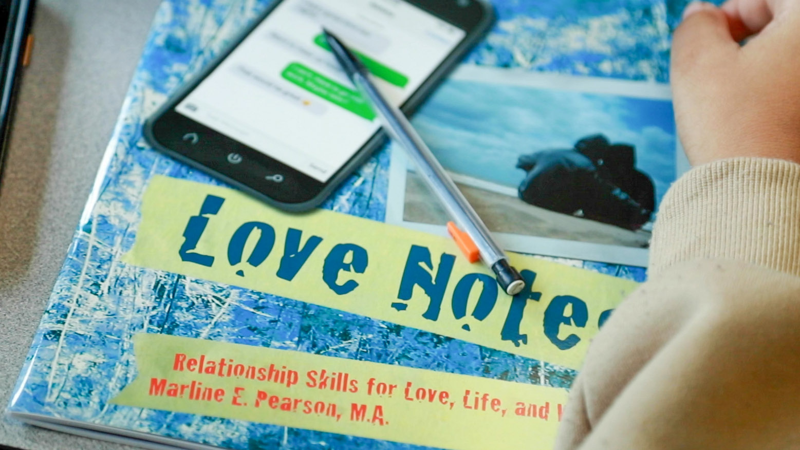 Love Notes text book on a student's desk Love Notes text book on a student's desk