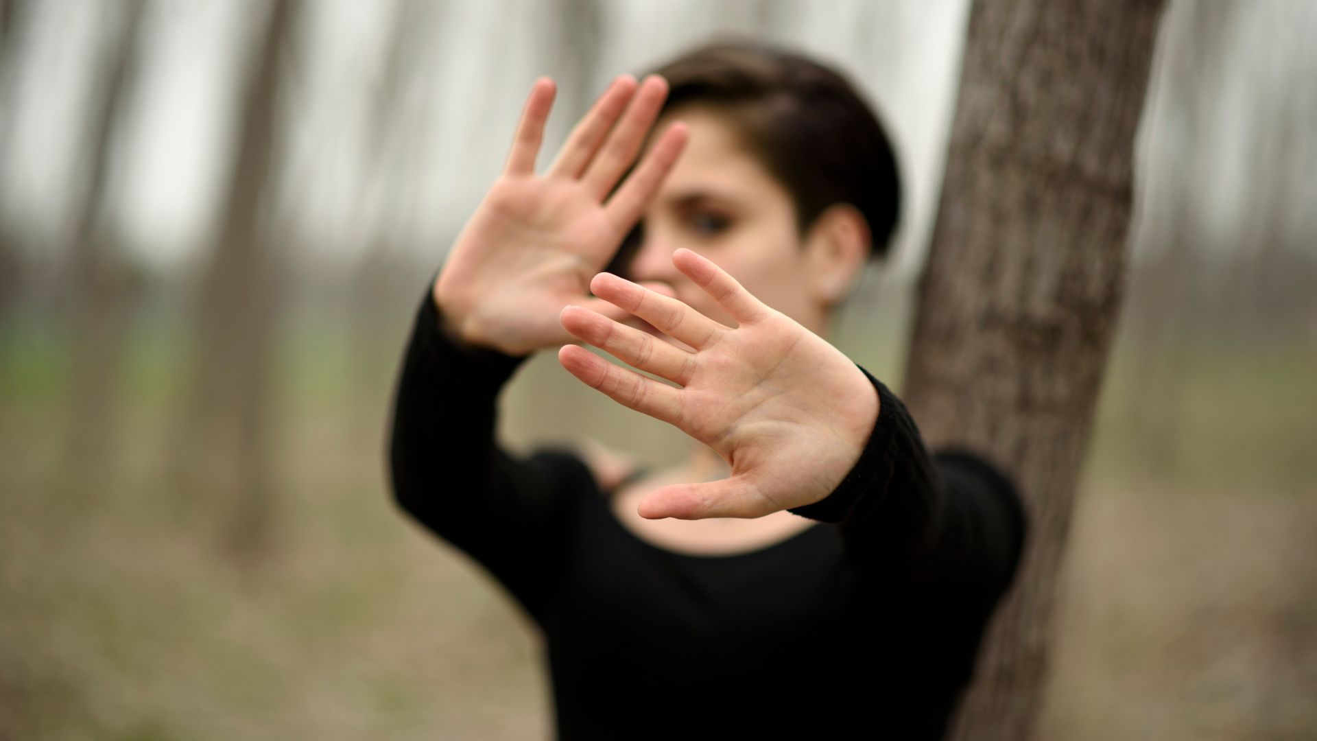 Person practicing self-defense moves Person practicing self-defense moves