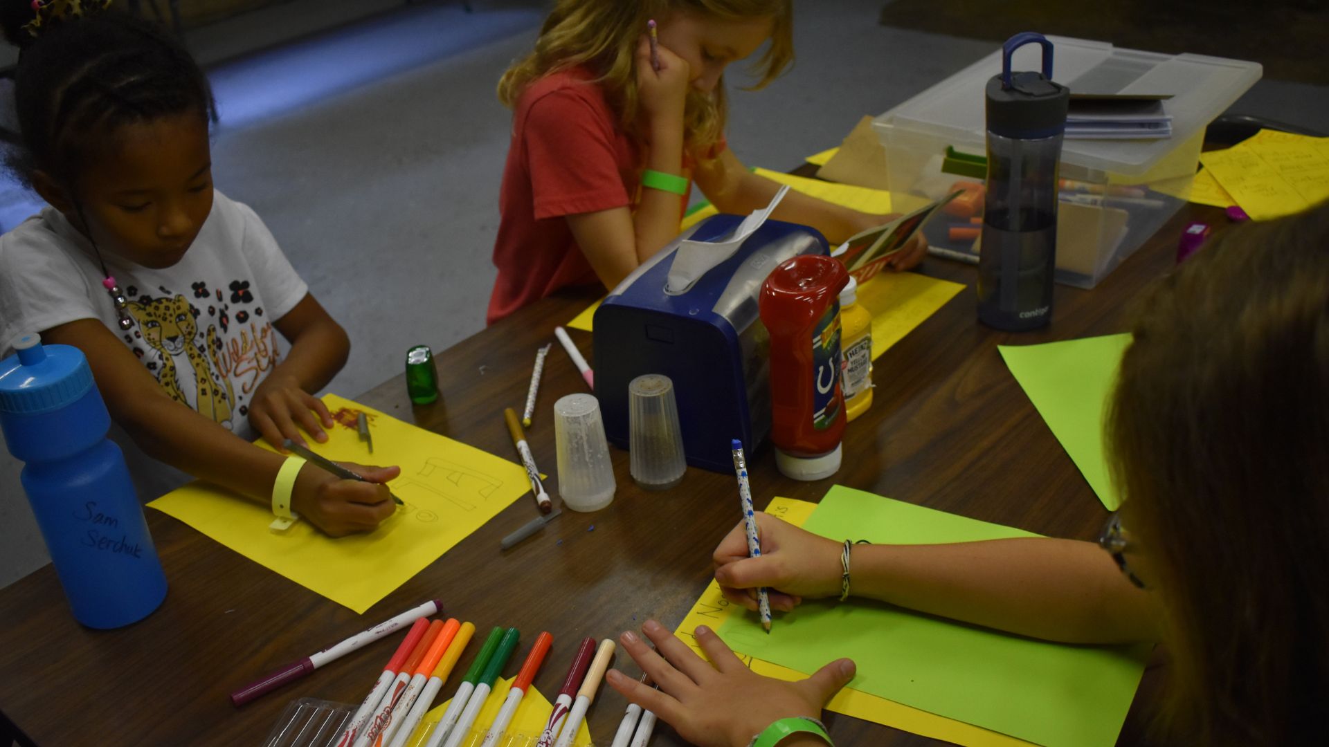Campers writing letters and doing crafts Campers writing letters and doing crafts