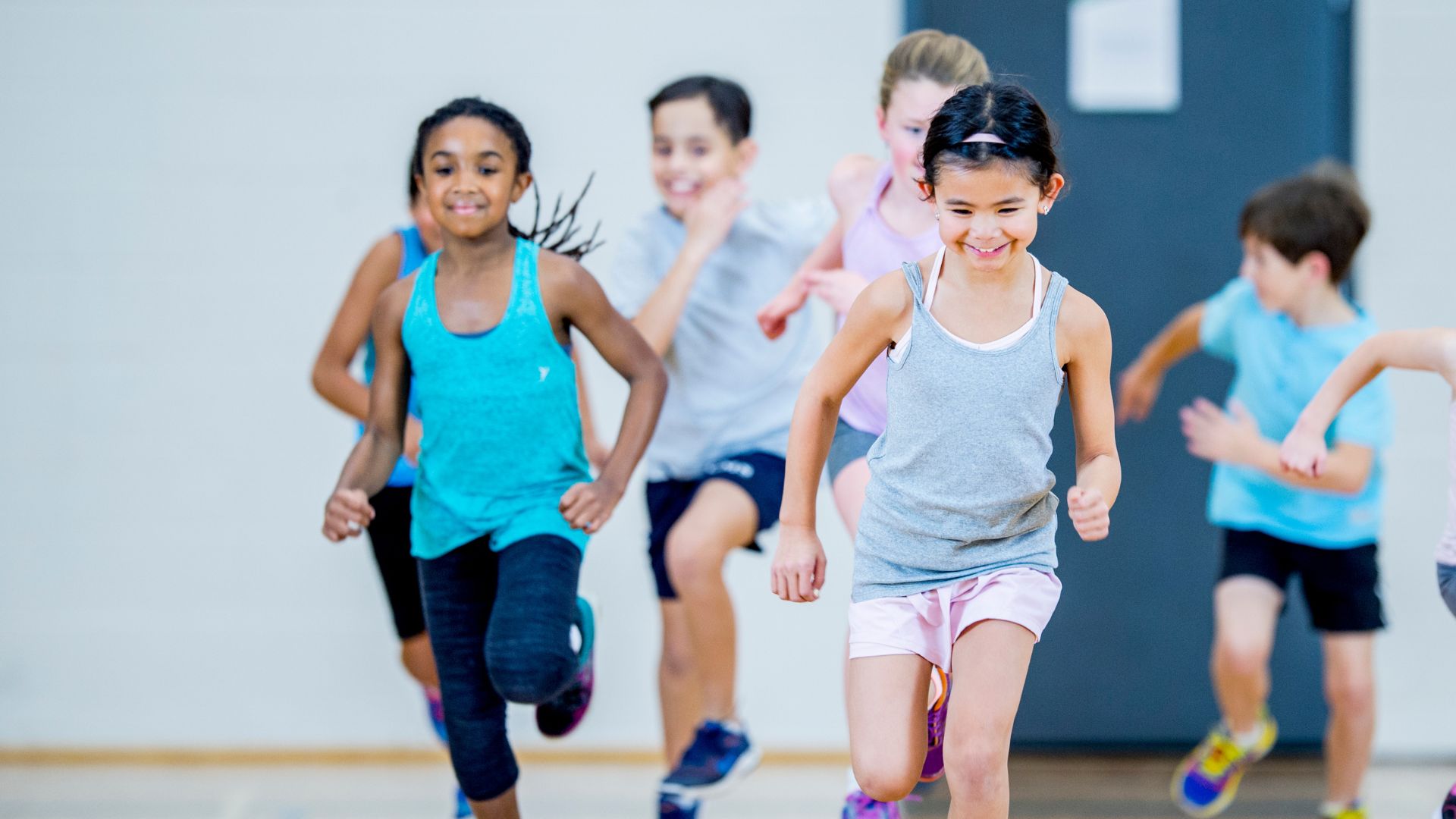 Kids running together training for sports Kids running together training for sports