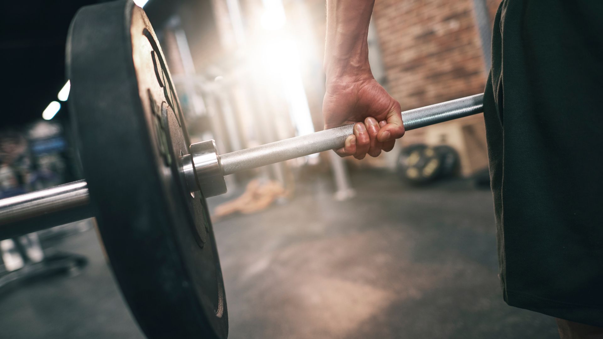 Man holding a weight bar Man holding a weight bar