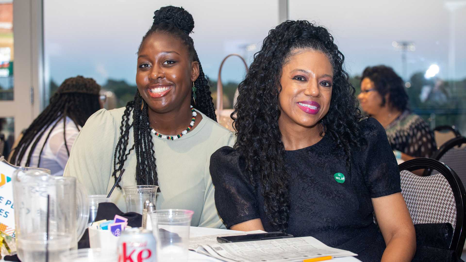 Two women sitting at table