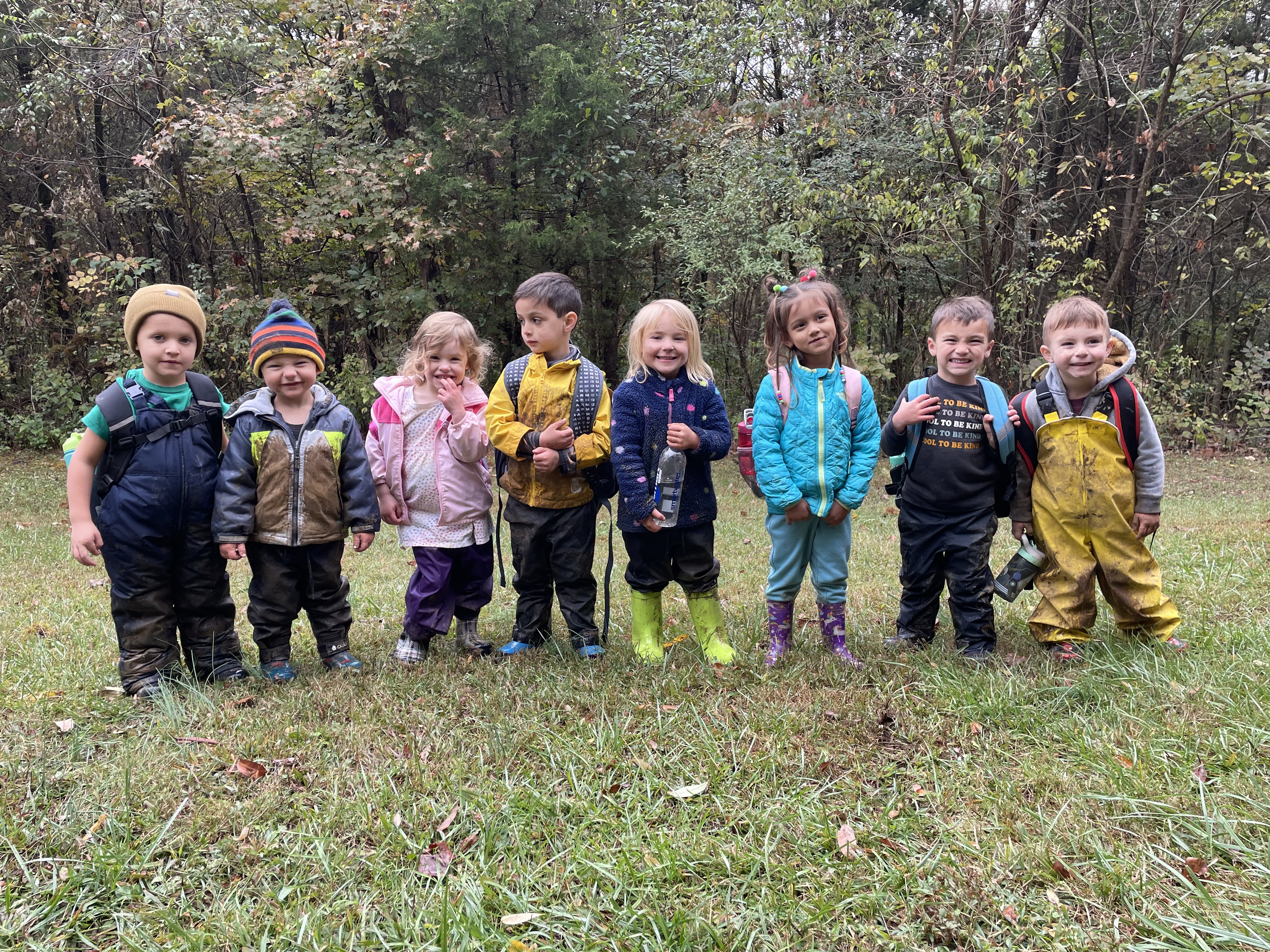 Children standing next to each other Children standing next to each other