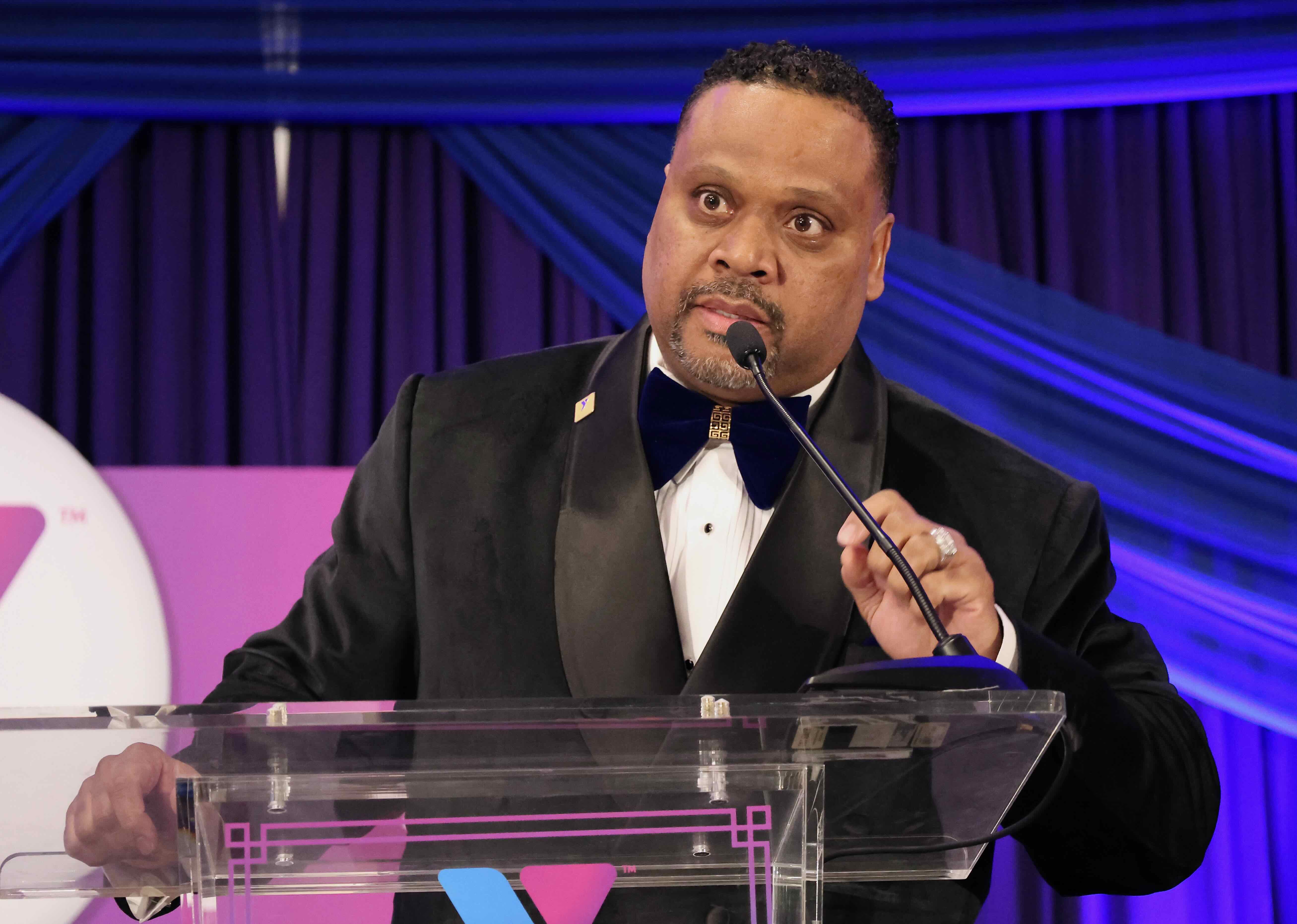 Man standing on podium giving a speech
