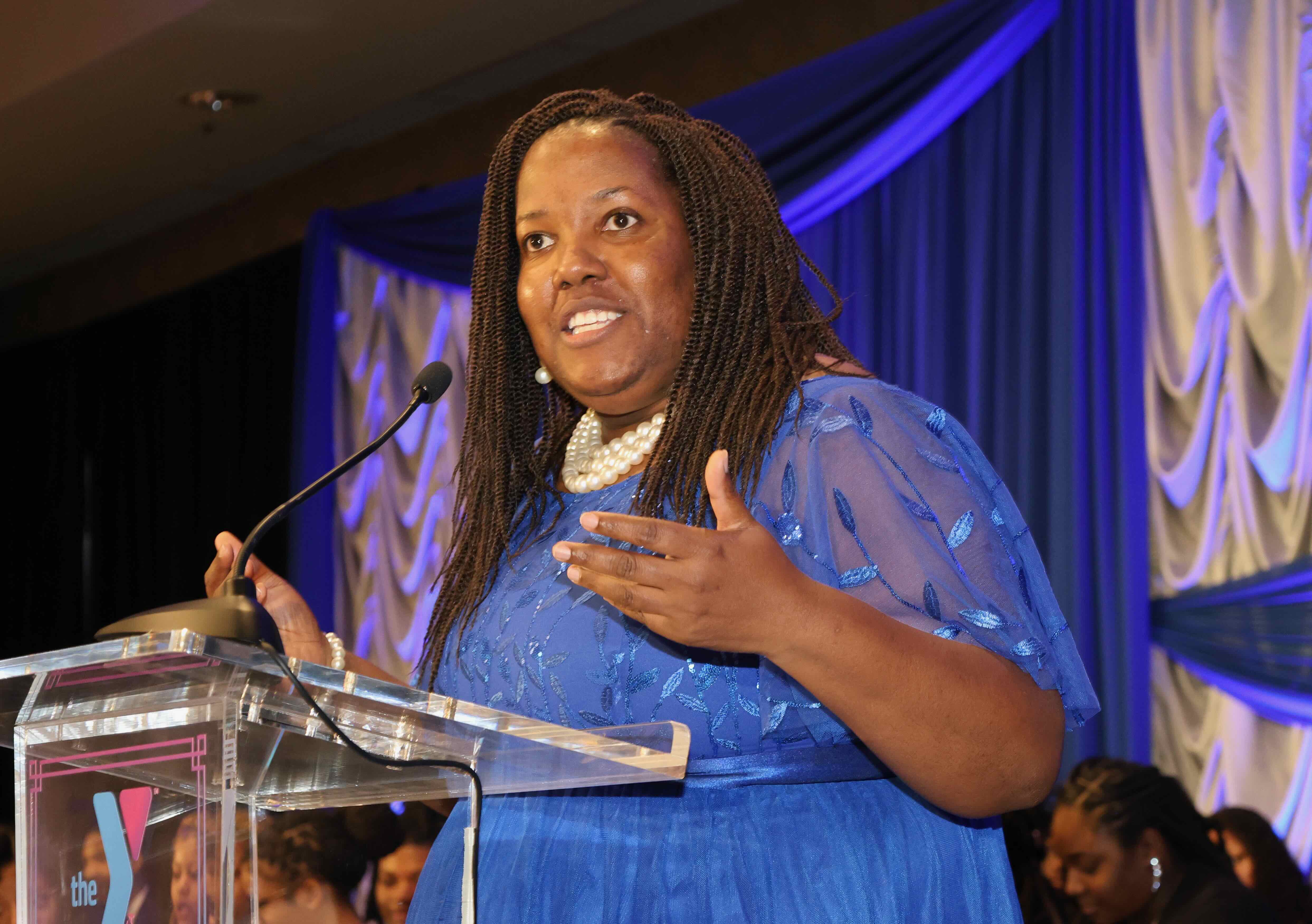 Speaker standing on podium