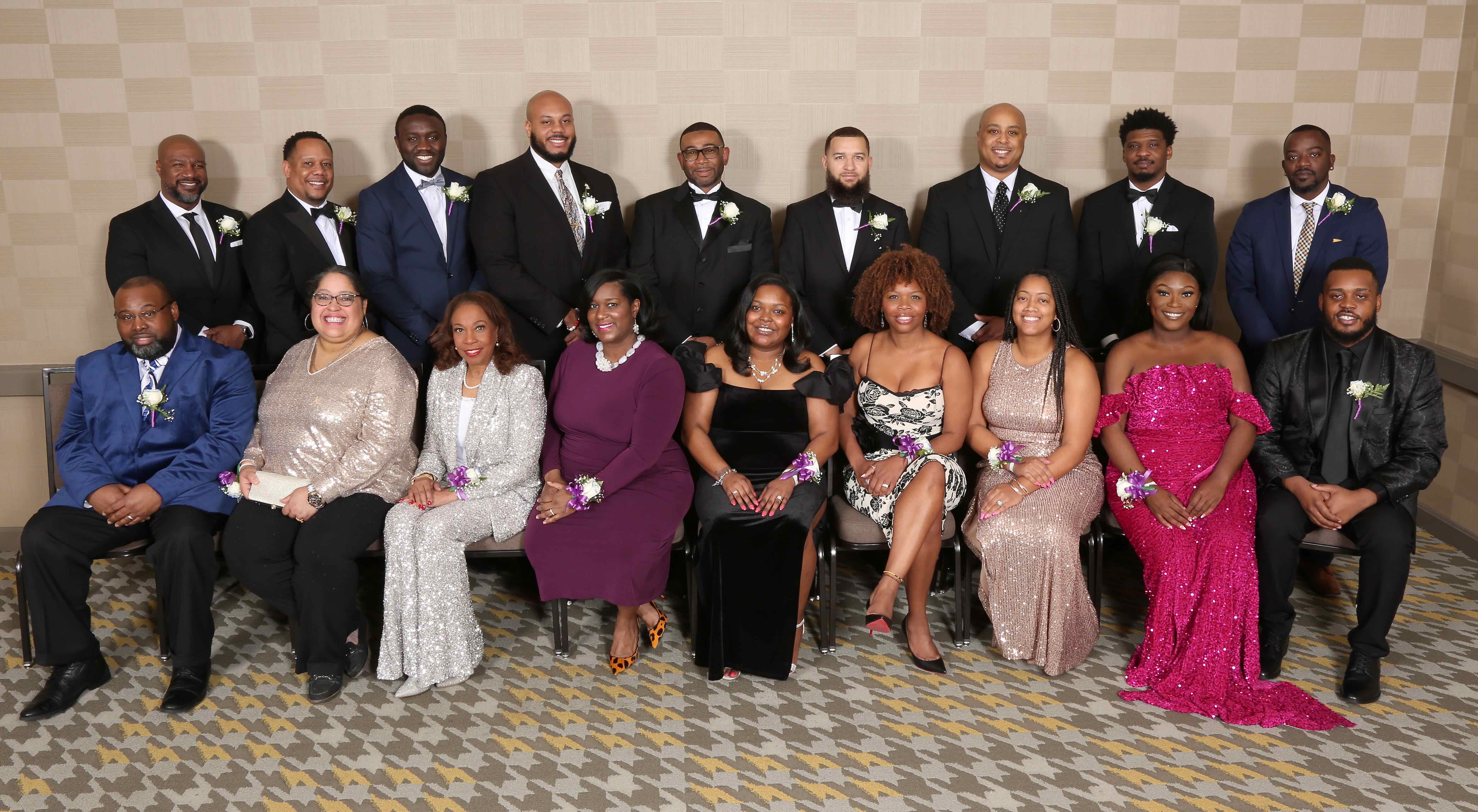 Group of adults sitting for photo