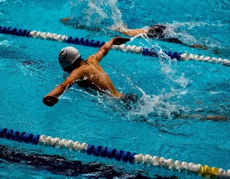 YMCA Louisville swim team members swimming laps YMCA Louisville swim team members swimming laps