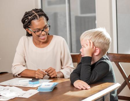 Tutor working with a young child Tutor working with a young child
