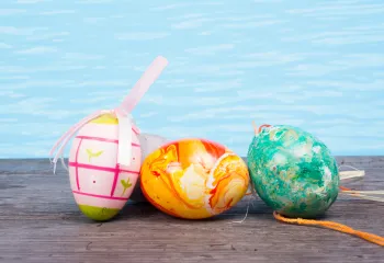 Easter eggs next to a swimming pool