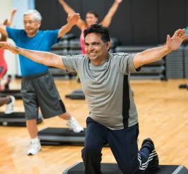 Adults lunging in group fitness class at YMCA Louisville