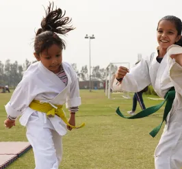Kids practicing martial arts outdoors