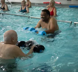 Group of people exercising at the pool