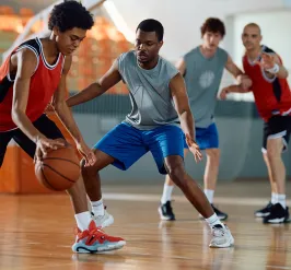 Boys Playing Indoor Basketball