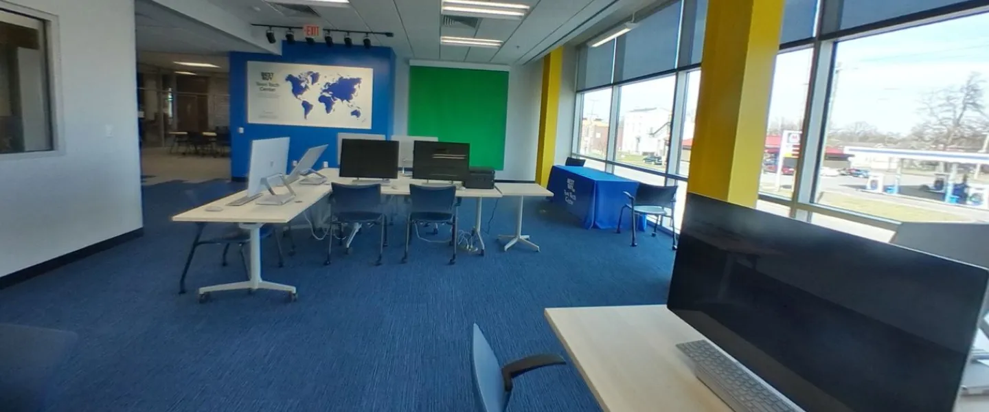 Computers on desks in the Teen Tech Center