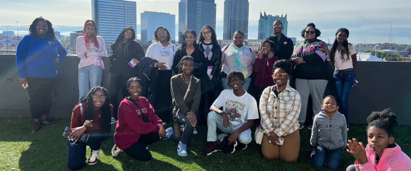 Group of Black Achievers together for a picture while on a college tour