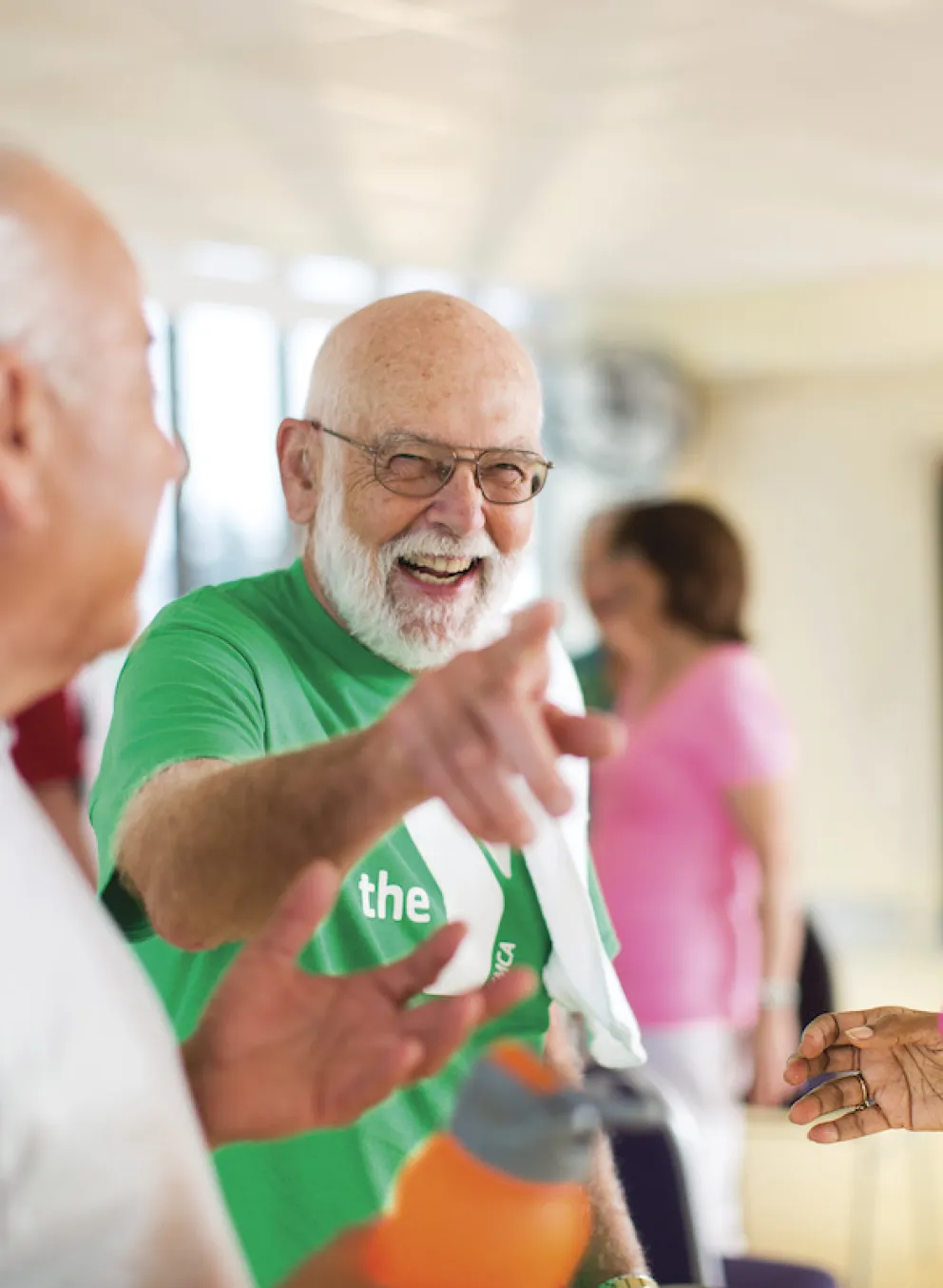 Older adults participating in a healthy living challenge laughing together