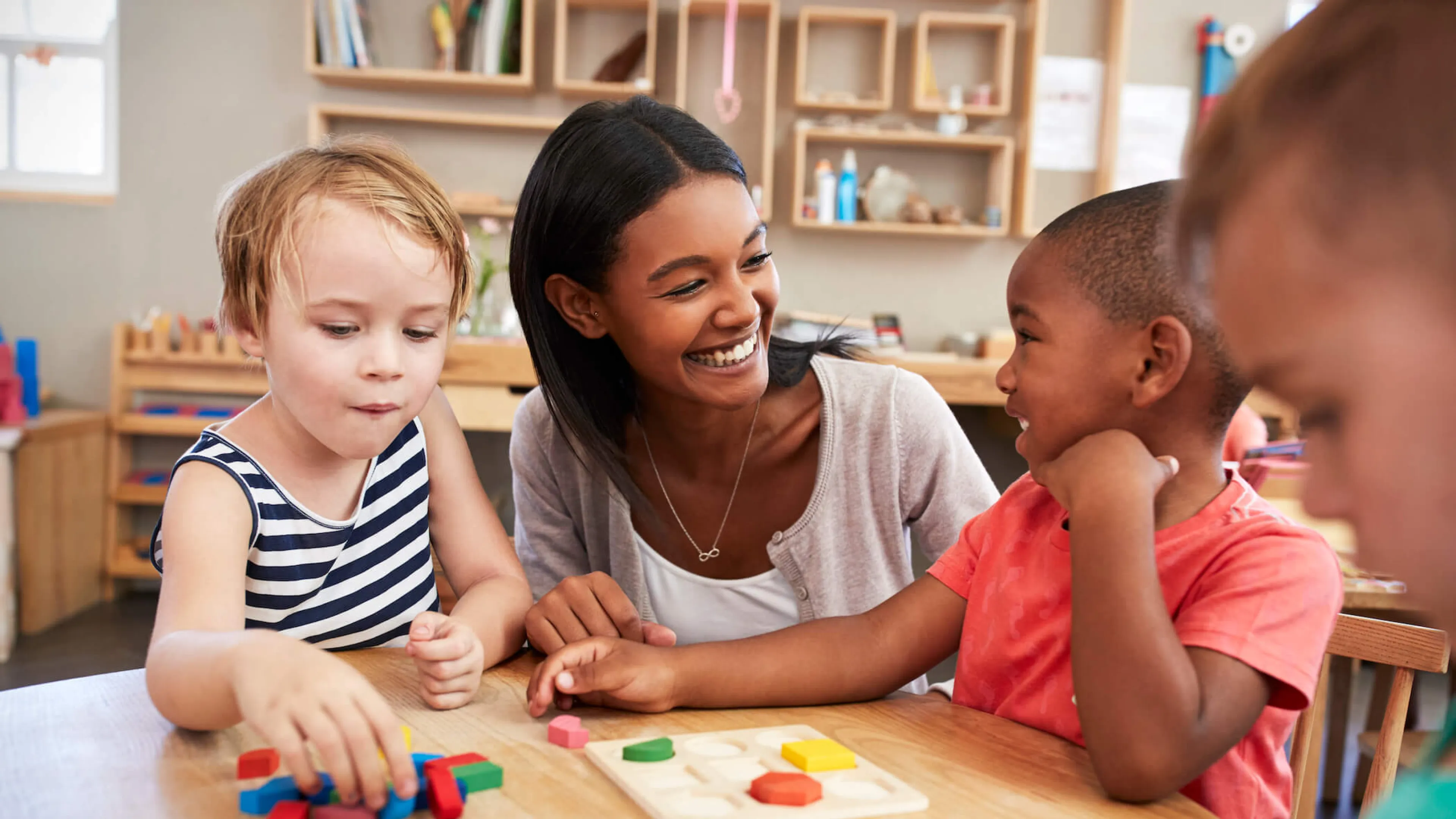 YMCA staff engages kids at child development center