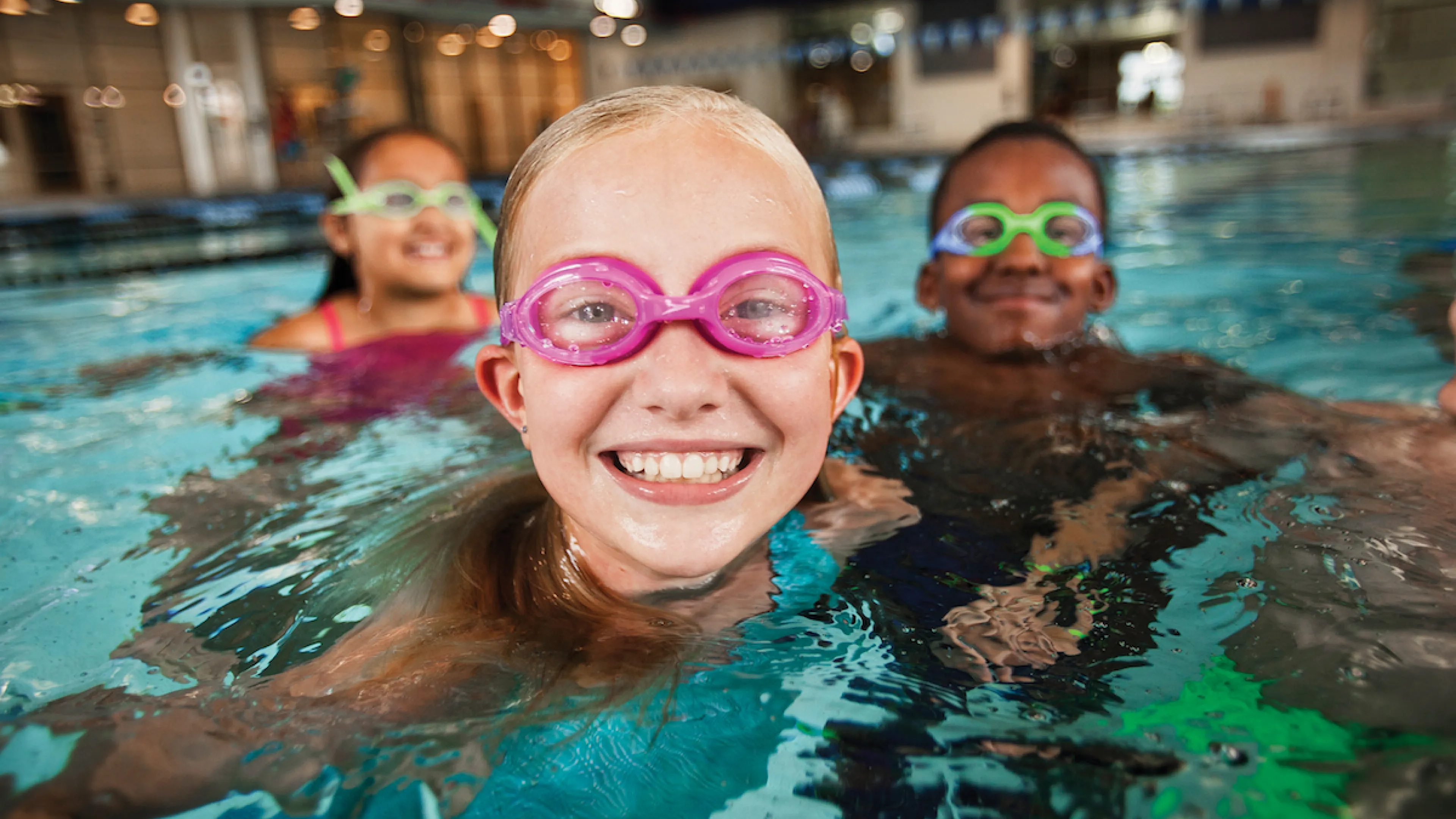 Children swimming at YMCA Louisville swimming pool