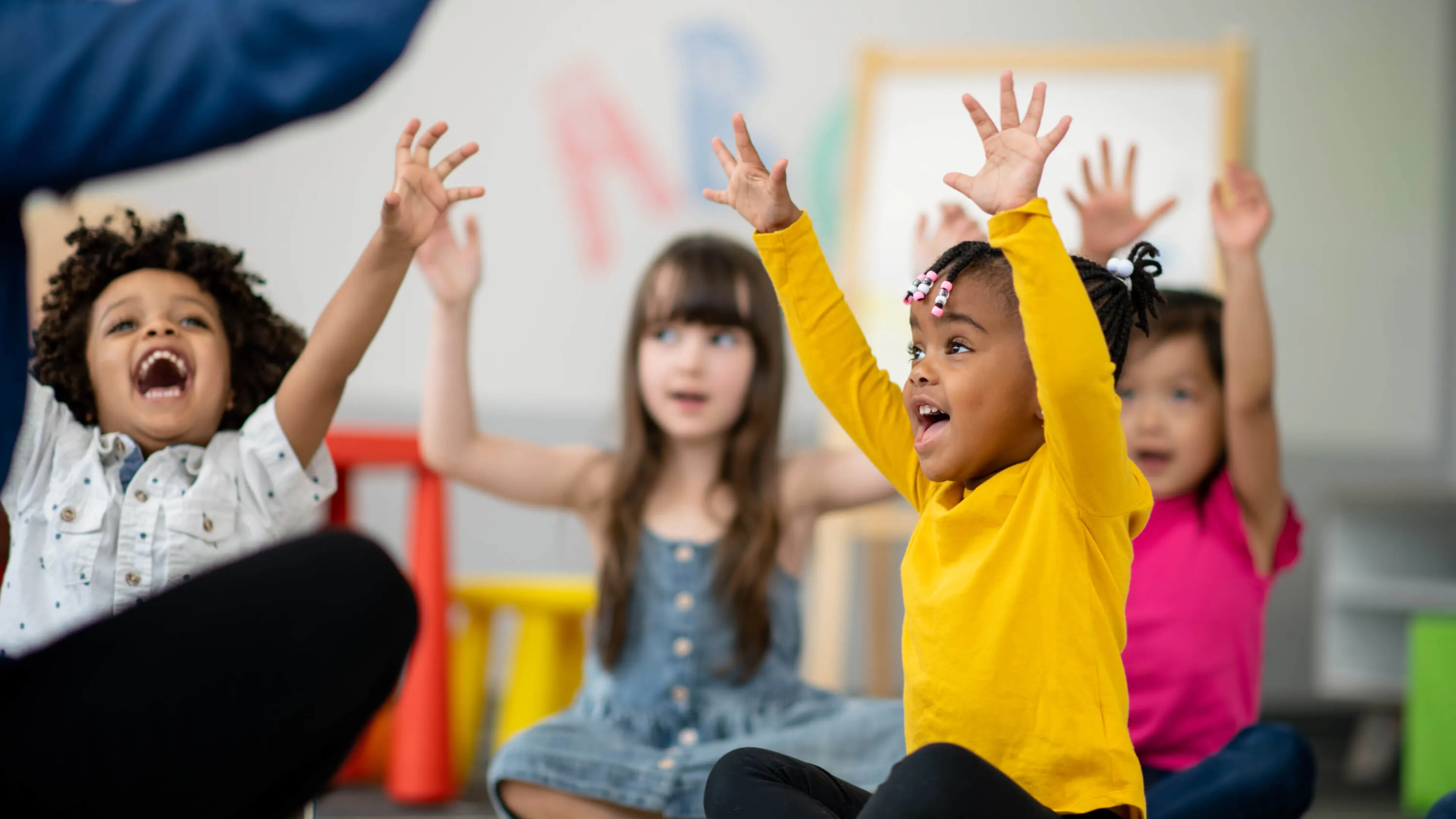 Children shouting in joy at YMCA child development center