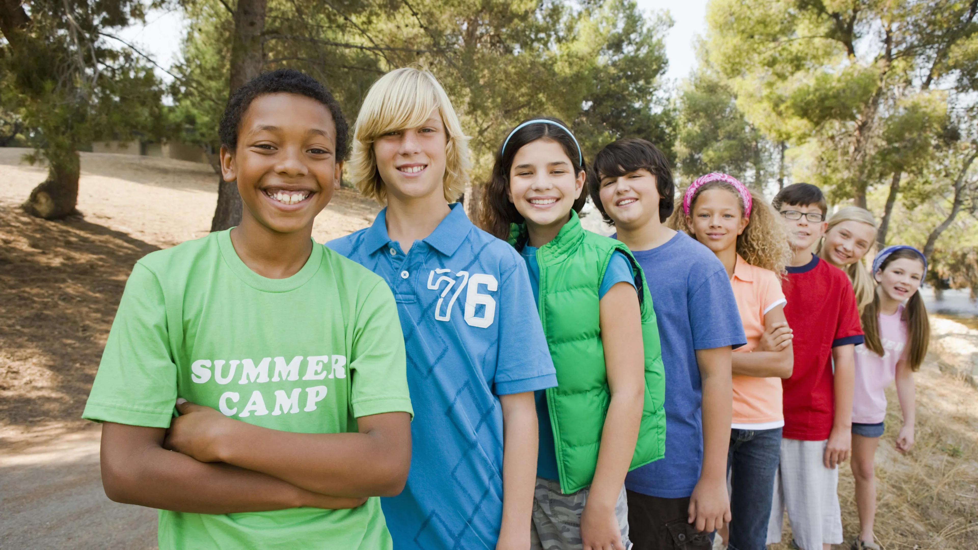 Group of teens standing next to each other
