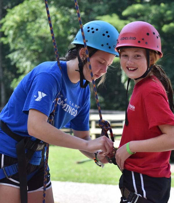 Girls preparing for rock climbing with YMCA Louisville outdoor recreational programs Girls preparing for rock climbing with YMCA Louisville outdoor recreational programs