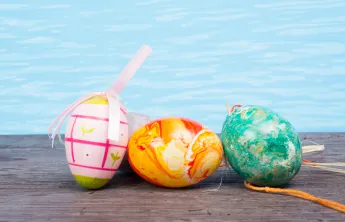 Easter eggs next to a swimming pool