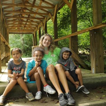 YMCA Louisville staff poses with children outdoors YMCA Louisville staff poses with children outdoors