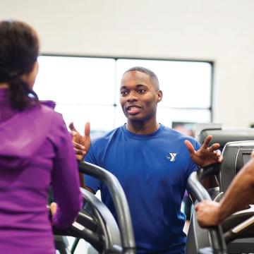 YMCA Louisville trainer coaching member for fitness assessment YMCA Louisville trainer coaching member for fitness assessment