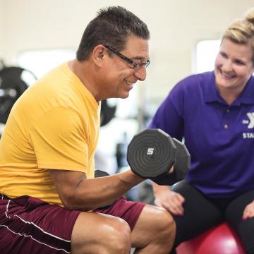 YMCA Louisville trainer coaching member for fitness assessment YMCA Louisville trainer coaching member for fitness assessment