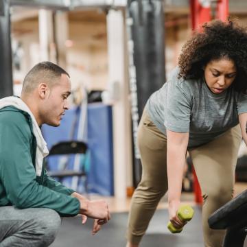 YMCA Louisville trainer coaching member for fitness assessment YMCA Louisville trainer coaching member for fitness assessment
