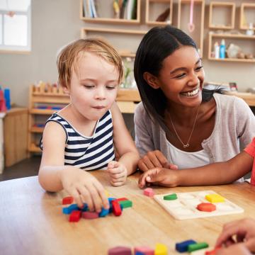 YMCA staff engages kids at child development center YMCA staff engages kids at child development center