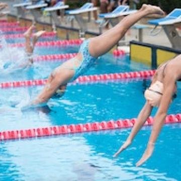 YMCA Louisville swim team members diving YMCA Louisville swim team members diving