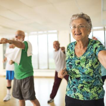 Older adults stretching at group dance class at YMCA Louisville Older adults stretching at group dance class at YMCA Louisville