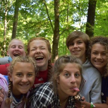 Five teens smile and make funny faces for the camera Five teens smile and make funny faces for the camera