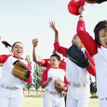 Kids cheering during youth baseball league game Kids cheering during youth baseball league game