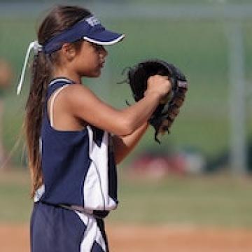 Kid playing in youth baseball game Kid playing in youth baseball game
