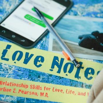 Love Notes text book on a student's desk Love Notes text book on a student's desk
