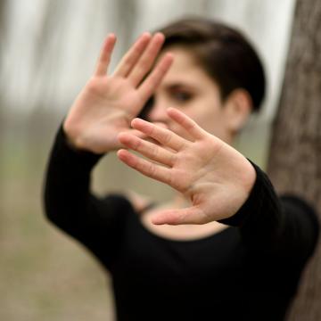 Person practicing self-defense moves Person practicing self-defense moves