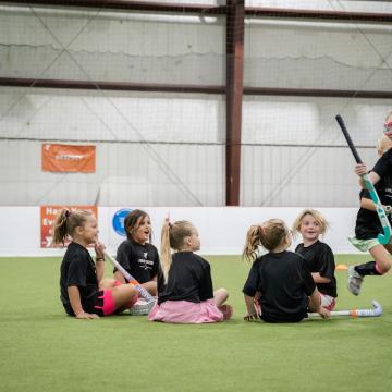 Kids learning how to play field hockey Kids learning how to play field hockey