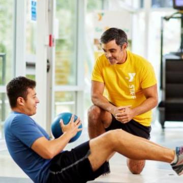 YMCA personal trainer working with a member YMCA personal trainer working with a member