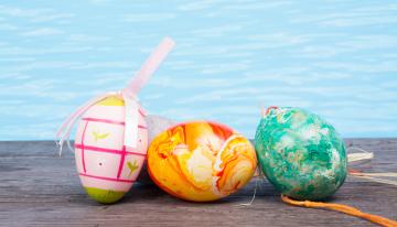 Easter eggs next to a swimming pool