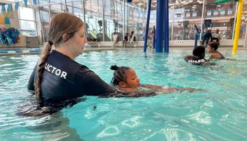 Safety Around Water instructor and child